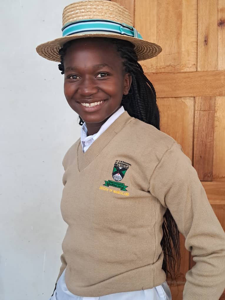 African Neurodiversity Movement A smiling African student in school uniform