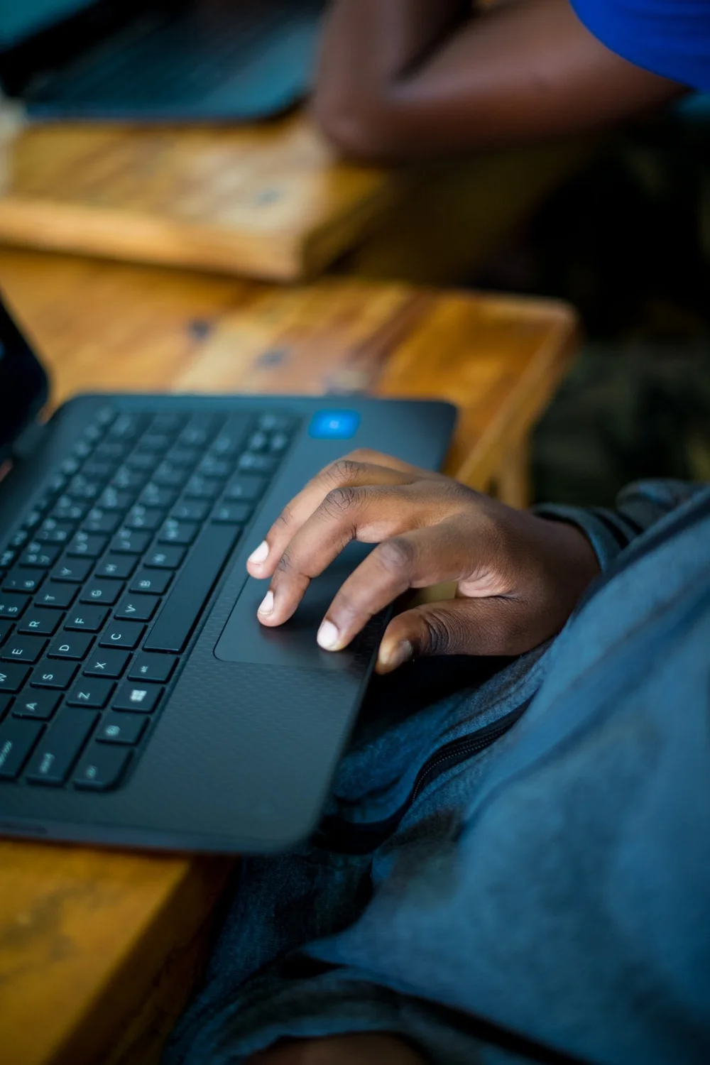 A person using a laptop during a learning session