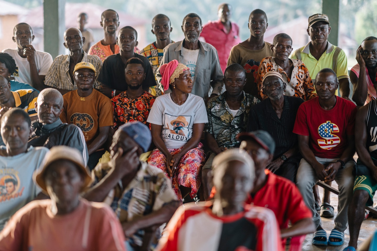 A large community group gathered together in a hall